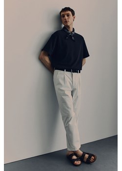 H & M - Bawełniane spodnie chinos Regular Fit - Biały ze sklepu H&M w kategorii Spodnie męskie - zdjęcie 170809896