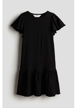 H & M - Dżersejowa sukienka z falbankowym rękawem - Czarny ze sklepu H&M w kategorii Sukienki dziewczęce - zdjęcie 170886385