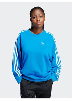 adidas Bluza 3-Stripes IN8488 Niebieski Oversize ze sklepu MODIVO w kategorii Bluzy damskie - zdjęcie 170887765