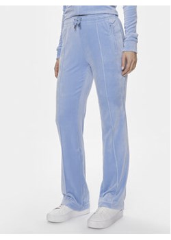 Juicy Couture Spodnie dresowe Tina JCAPW045 Fioletowy Regular Fit ze sklepu MODIVO w kategorii Spodnie damskie - zdjęcie 170911139