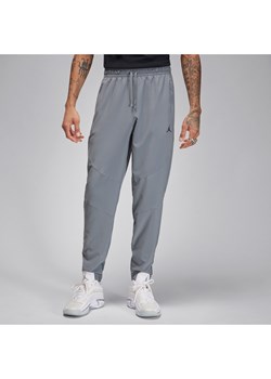 Męskie spodnie z tkaniny Dri-FIT Jordan Sport - Szary ze sklepu Nike poland w kategorii Spodnie męskie - zdjęcie 170914355