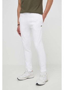 Lacoste spodnie dresowe męskie kolor biały gładkie ze sklepu PRM w kategorii Spodnie męskie - zdjęcie 170927789