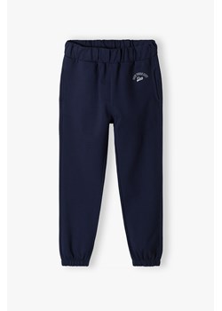 Granatowe spodnie dresowe dla dziewczynki - Lincoln&Sharks ze sklepu 5.10.15 w kategorii Spodnie chłopięce - zdjęcie 170966717