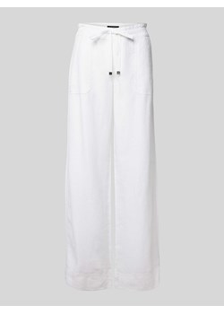 Spodnie materiałowe z szeroką nogawką i wiązanym paskiem model ‘JOVONIE’ ze sklepu Peek&Cloppenburg  w kategorii Spodnie damskie - zdjęcie 171001447