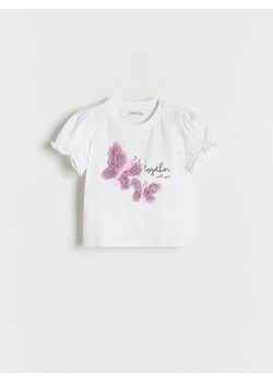 Reserved - T-shirt z ozdobną aplikacją - złamana biel ze sklepu Reserved w kategorii Bluzki dziewczęce - zdjęcie 171198526