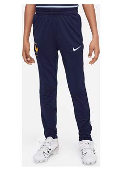 Dzianinowe spodnie piłkarskie dla dużych dzieci Nike Dri-FIT FFF Strike - Niebieski ze sklepu Nike poland w kategorii Spodnie chłopięce - zdjęcie 171206749