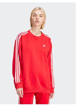 adidas Bluza 3-Stripes IN8487 Czerwony Oversize ze sklepu MODIVO w kategorii Bluzy damskie - zdjęcie 171211949