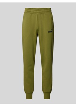 Spodnie dresowe o kroju regular fit z nadrukiem z logo ze sklepu Peek&Cloppenburg  w kategorii Spodnie męskie - zdjęcie 171230265