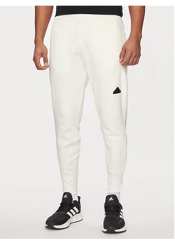 adidas Spodnie dresowe Z.N.E. Premium IN1912 Biały Regular Fit ze sklepu MODIVO w kategorii Spodnie męskie - zdjęcie 171251276