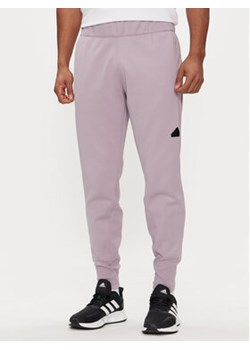 adidas Spodnie dresowe Z.N.E. Winterized IR5245 Fioletowy Regular Fit ze sklepu MODIVO w kategorii Spodnie męskie - zdjęcie 171255488