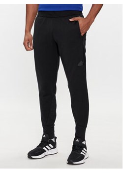 adidas Spodnie dresowe Z.N.E. Winterized IN1899 Czarny Regular Fit ze sklepu MODIVO w kategorii Spodnie męskie - zdjęcie 171255705