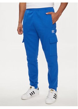 adidas Spodnie dresowe adicolor Trefoil IP2758 Niebieski Slim Fit ze sklepu MODIVO w kategorii Spodnie męskie - zdjęcie 171342576