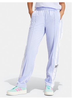 adidas Spodnie dresowe Adibreak IP0625 Fioletowy Regular Fit ze sklepu MODIVO w kategorii Spodnie damskie - zdjęcie 171342728