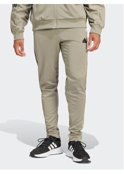 adidas Spodnie dresowe Tiro IS1504 Zielony Regular Fit ze sklepu MODIVO w kategorii Spodnie męskie - zdjęcie 171345377