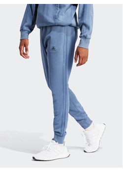 adidas Spodnie dresowe ALL SZN 3-Stripes IR5202 Niebieski Regular Fit ze sklepu MODIVO w kategorii Spodnie męskie - zdjęcie 171377489