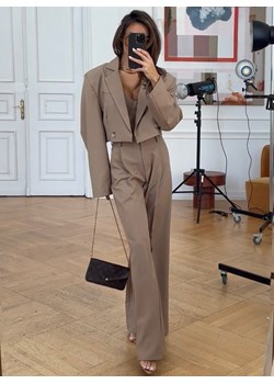 Beżowe szerokie spodnie Koriaa - beżowy ze sklepu pakuten.pl w kategorii Spodnie damskie - zdjęcie 171551225