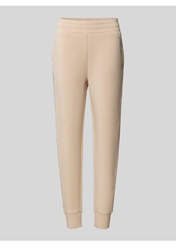 Spodnie dresowe o kroju regular fit z lampasami model ‘SIMONNE’ ze sklepu Peek&Cloppenburg  w kategorii Spodnie damskie - zdjęcie 171563988