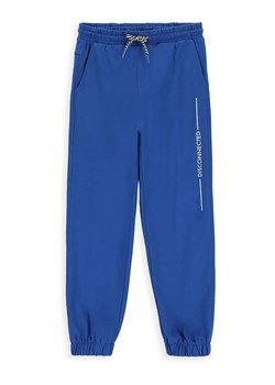MOKIDA Spodnie dresowe w kolorze niebieskim ze sklepu Limango Polska w kategorii Spodnie chłopięce - zdjęcie 171567039