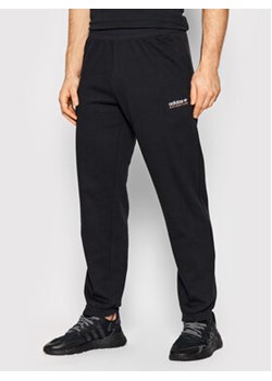 adidas Spodnie dresowe Adventure HF4771 Czarny Regular Fit ze sklepu MODIVO w kategorii Spodnie męskie - zdjęcie 171593475