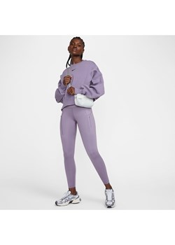 Damskie legginsy ze średnim stanem i kieszeniami o długości 7/8 zapewniające mocne wsparcie Nike Go - Fiolet ze sklepu Nike poland w kategorii Spodnie damskie - zdjęcie 171953069