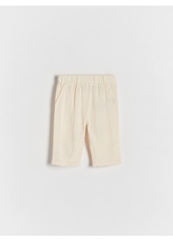Reserved - Tkaninowe spodnie z lnem - kremowy ze sklepu Reserved w kategorii Spodenki niemowlęce - zdjęcie 171960696
