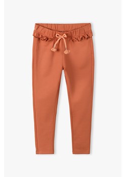 Spodnie dziewczęce z oddolną falbanką ze sklepu 5.10.15 w kategorii Spodnie dziewczęce - zdjęcie 172002699