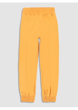 MOKIDA Spodnie dresowe w kolorze żółtym ze sklepu Limango Polska w kategorii Spodnie dziewczęce - zdjęcie 172019319