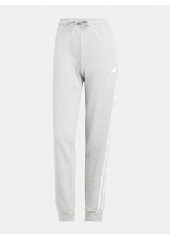 adidas Spodnie dresowe Future Icons 3-Stripes IS3662 Szary Regular Fit ze sklepu MODIVO w kategorii Spodnie damskie - zdjęcie 172104528