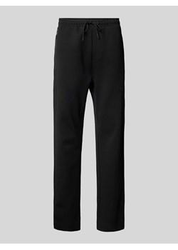 Spodnie dresowe z aplikacją z logo model ‘Hadim’ ze sklepu Peek&Cloppenburg  w kategorii Spodnie męskie - zdjęcie 172115769