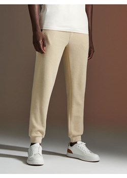 Sinsay - Spodnie dresowe - kremowy ze sklepu Sinsay w kategorii Spodnie męskie - zdjęcie 172141949