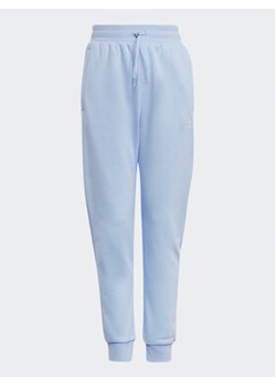 adidas Spodnie dresowe Adicolor Joggers IC6133 Błękitny Regular Fit ze sklepu MODIVO w kategorii Spodnie dziewczęce - zdjęcie 172166328