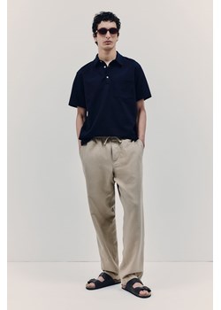 H & M - Spodnie z domieszką lnu Relaxed Fit - Beżowy ze sklepu H&M w kategorii Spodnie męskie - zdjęcie 172183527