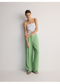Reserved - Spodnie z lyocellem - jasnozielony ze sklepu Reserved w kategorii Spodnie damskie - zdjęcie 172290805