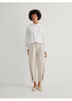 Reserved - Spodnie z zapięciem na nogawkach - kremowy ze sklepu Reserved w kategorii Spodnie damskie - zdjęcie 172306585