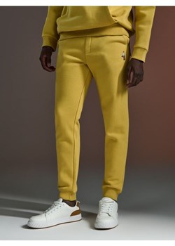 Sinsay - Spodnie dresowe jogger - żółty ze sklepu Sinsay w kategorii Spodnie męskie - zdjęcie 172385785