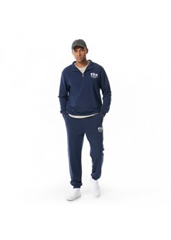 Męskie spodnie dresowe Fila Lisbonn - granatowe ze sklepu Sportstylestory.com w kategorii Spodnie męskie - zdjęcie 172398516