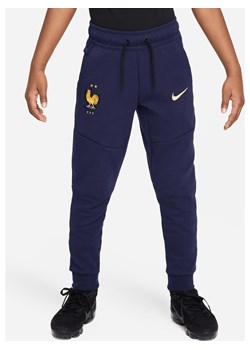 Spodnie piłkarskie dla dużych dzieci (chłopców) Nike FFF Tech Fleece - Niebieski ze sklepu Nike poland w kategorii Spodnie chłopięce - zdjęcie 172407256