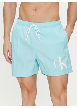 Calvin Klein Swimwear Szorty kąpielowe KM0KM01003 Błękitny Regular Fit ze sklepu MODIVO w kategorii Kąpielówki - zdjęcie 172447569