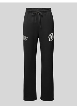 Spodnie dresowe o kroju regular fit z nadrukiem z logo ze sklepu Peek&Cloppenburg  w kategorii Spodnie męskie - zdjęcie 172536579