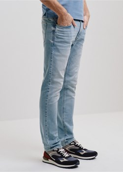 Niebieskie spodnie jeansowe męskie ze sklepu OCHNIK w kategorii Spodnie męskie - zdjęcie 172555795