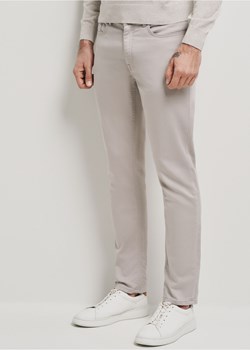 Beżowe spodnie męskie ze sklepu OCHNIK w kategorii Spodnie męskie - zdjęcie 172561416