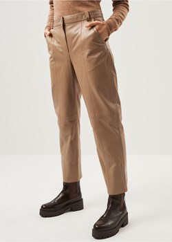 Beżowe skórzane spodnie damskie ze sklepu OCHNIK w kategorii Spodnie damskie - zdjęcie 172566669