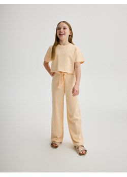 Reserved - Bawełniane spodnie - jasnopomarańczowy ze sklepu Reserved w kategorii Spodnie dziewczęce - zdjęcie 172576779