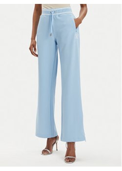 Juicy Couture Spodnie dresowe Kurt JCSBJ224418 Błękitny Regular Fit ze sklepu MODIVO w kategorii Spodnie damskie - zdjęcie 172591807