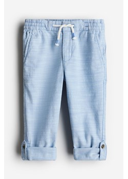H & M - Podwijane spodnie Loose Fit - Niebieski ze sklepu H&M w kategorii Spodnie chłopięce - zdjęcie 172631398