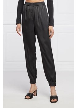 GUESS Spodnie JAY | Loose fit ze sklepu Gomez Fashion Store w kategorii Spodnie damskie - zdjęcie 172945908