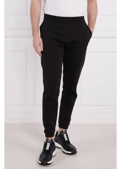 Calvin Klein Spodnie dresowe LOGO TAPE | Comfort fit ze sklepu Gomez Fashion Store w kategorii Spodnie męskie - zdjęcie 172946578