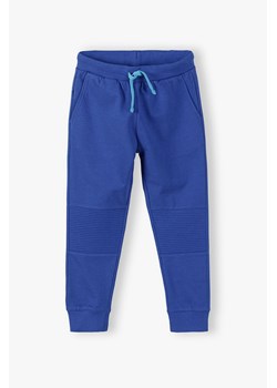 Spodnie dresowe wzmocnione na kolanach - niebieskie ze sklepu 5.10.15 w kategorii Spodnie chłopięce - zdjęcie 173013256