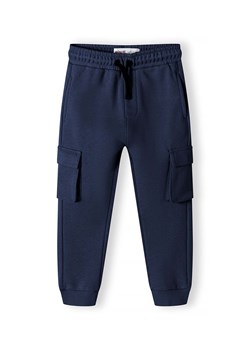 Dresowe spodnie typu bojówki niemowlęce- granatowe ze sklepu 5.10.15 w kategorii Spodnie chłopięce - zdjęcie 173013265