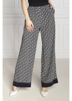 Tommy Hilfiger Spodnie MONOGRAM | flare fit ze sklepu Gomez Fashion Store w kategorii Spodnie damskie - zdjęcie 173027149